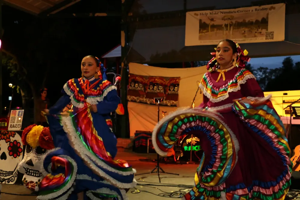 Folklorico dancers in colorful traditional costumes perform