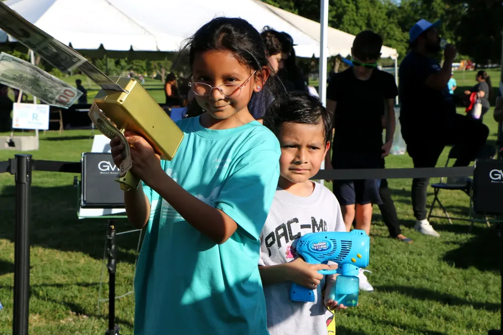 A young girl smiles brightly at Celebrate Davis
